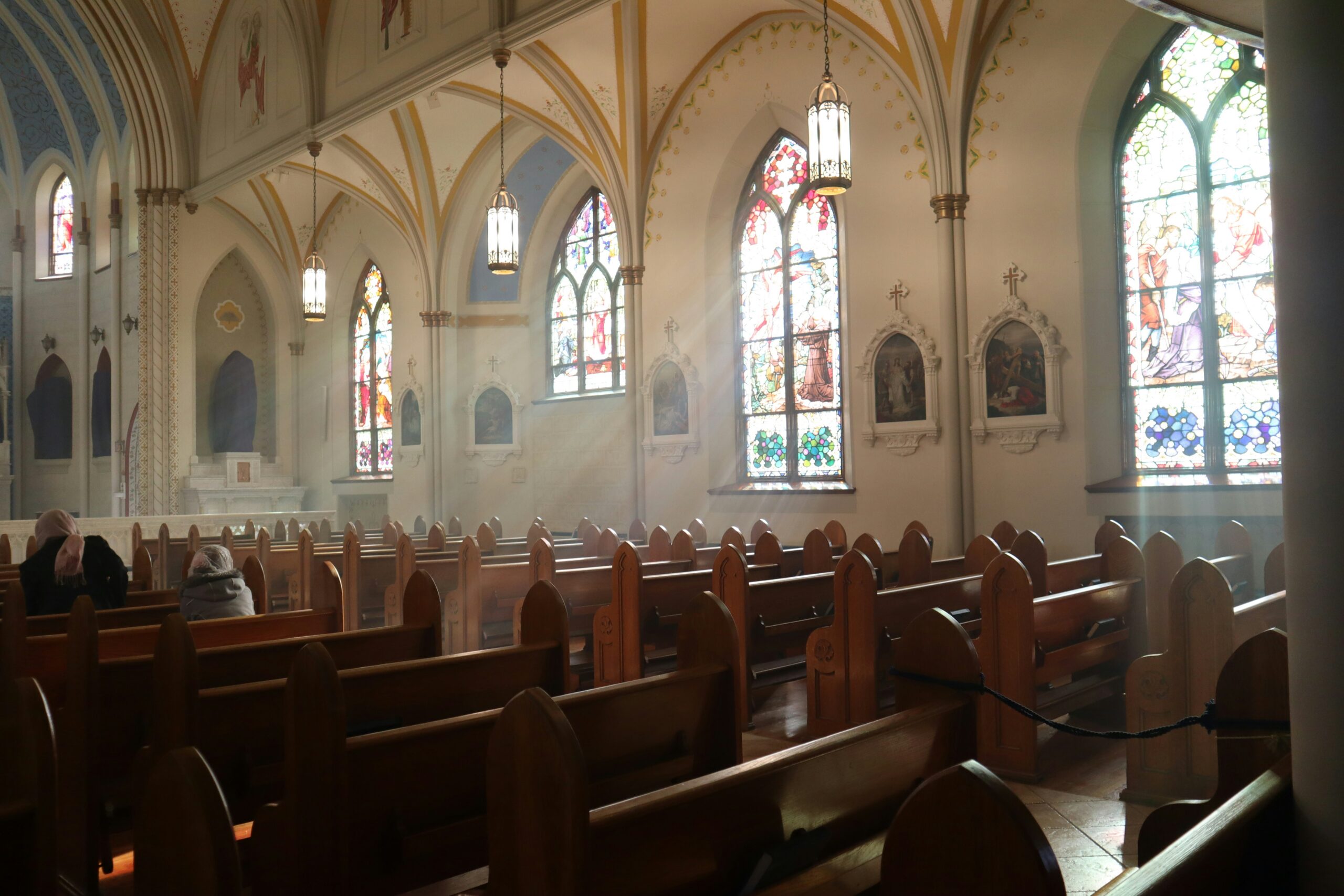 brown wooden chairs inside church